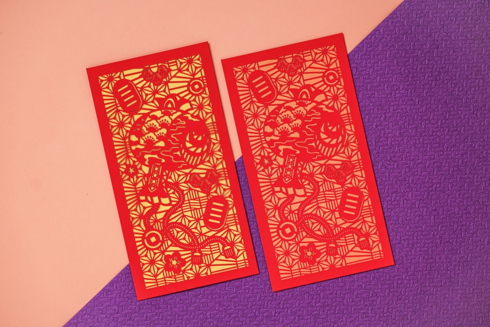 新都會廣場「幸▪紙美藝」利是封套裝以剪紙鏤空外封搭配雙色襯紙。